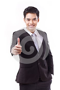 Successful businessman giving thumb up