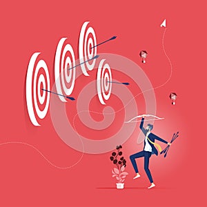 Successful businessman hit many target with bow and arrow-Business success concept photo