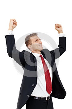 Successful businessman holding arms up, success!