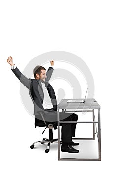 Successful businessman raising hands up