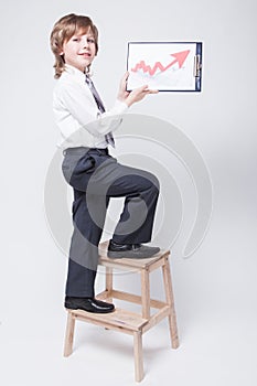 Successful businessman shows a graph of profit growth