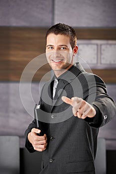 Successful businessman smiling happily