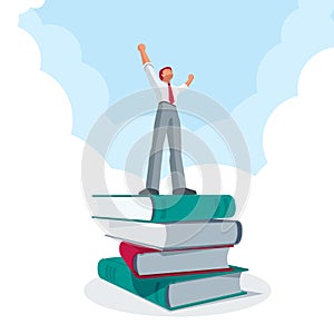 Successful businessman standing on big book stack