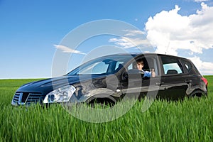 Successful businessman is thumbs-up in own car