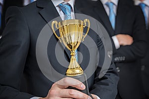 Successful businessman was awarded with trophy for excelent skills