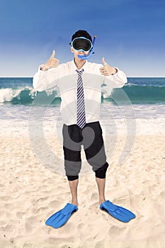 Successful businessman wearing snorkeling tools 1