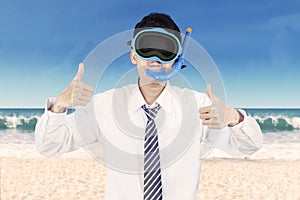 Successful businessman wearing snorkeling tools