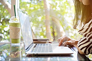 Successful businessman working in cafe during coffee break, Closeup of man`s hands using modern laptop