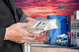 Successful businessmen hold a lot of money on containers box wi