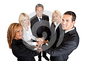 Successful businesspeople stacking their hands