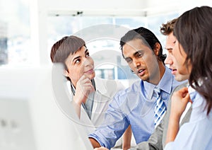 Successful businessteam working at a computer