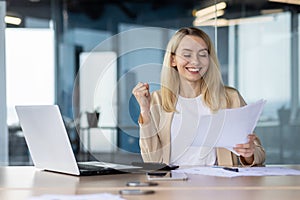 Successful businesswoman celebrating a triumph at work