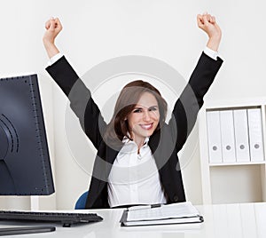 Successful Businesswoman At Desk