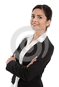 Successful businesswoman with folded arms isolated on white.