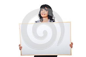 Successful businesswoman holding blank placard