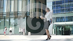 Successful businesswoman lawyer in white jacket and black dress