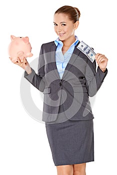 Successful businesswoman with a piggy bank