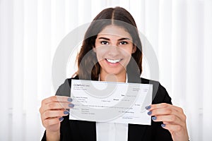 Successful Businesswoman Showing Cheque