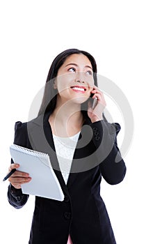Successful businesswoman talking on the phone and holding note p