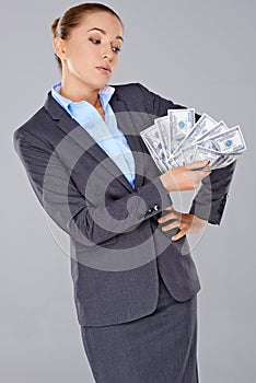 Successful businesswoman with a wad of money
