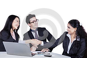 Successful businesswomen shaking hands
