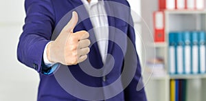 Successful career. Well done. Good job. Male hand show thumbs up sign. Success and approval concept. Gesture expresses
