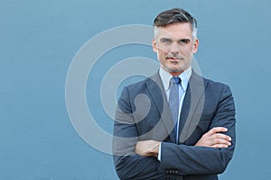 Successful Caucasian elegant businessman with arms crossed