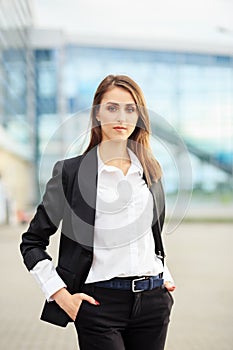 Successful confident woman in a suit. Concept for business, employees, partners and entrepreneurs