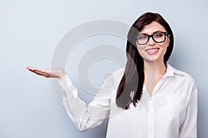 Successful confident young woman presenting new product