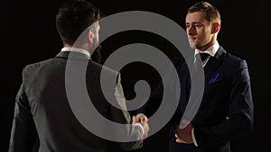 A successful contract. Two colleagues handshaking after meeting. Two business men shake hands in sign of the contract.