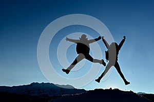 Successful couple jumping for joy