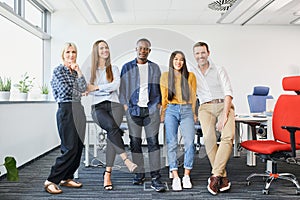 Successful diverse business people standing together at startup office