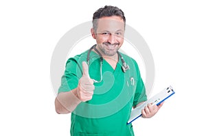 Successful doctor or medic showing like gesture
