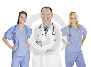 Group of confident doctors and nurses with their arms crossed displaying some attitude