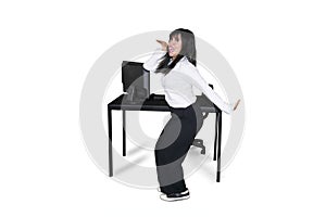 Successful entrepreneur dancing near her desk