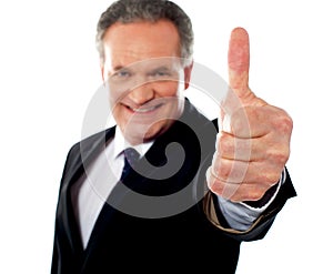 Successful entrepreneur gesturing thumbs-up