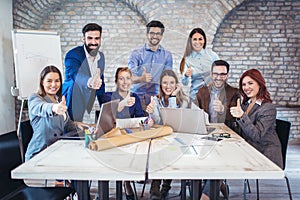 Entrepreneurs and business people showing thumbs up