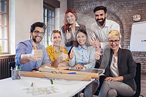 Entrepreneurs and business people showing thumbs up