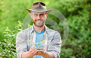 Successful farmer hold plant in ground in hands. Eco farm worker. Earth day. happy earth day. Eco living. farming and