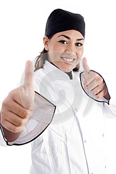 Successful female chef showing thumbs up