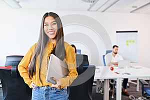 Successful female entrepreneur or employee at coworking office.