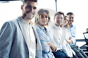 Successful friendly team with happy workers in office.