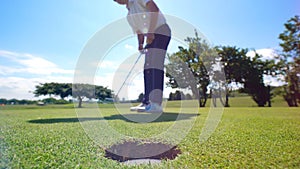 Successful golf swing held by the male player