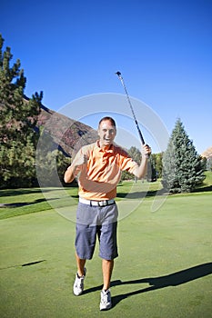 Successful Golfer Making Putt photo