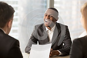 Successful happy black male candidate getting hired, got a job