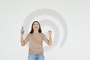 Successful happy woman holding obile phone on a white background