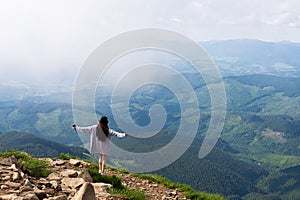 Successful hiking woman silhouette on top of mountains, motivation and inspiration in beautiful view