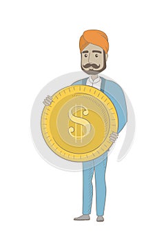 Successful hindu businessman with dollar coin.