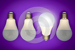 Successful idea, creativity and innovation concept. Lightbulbs upside down, one glows.