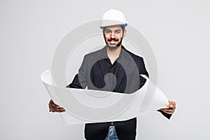 Successful indian Architect pointing with blueprint on white background